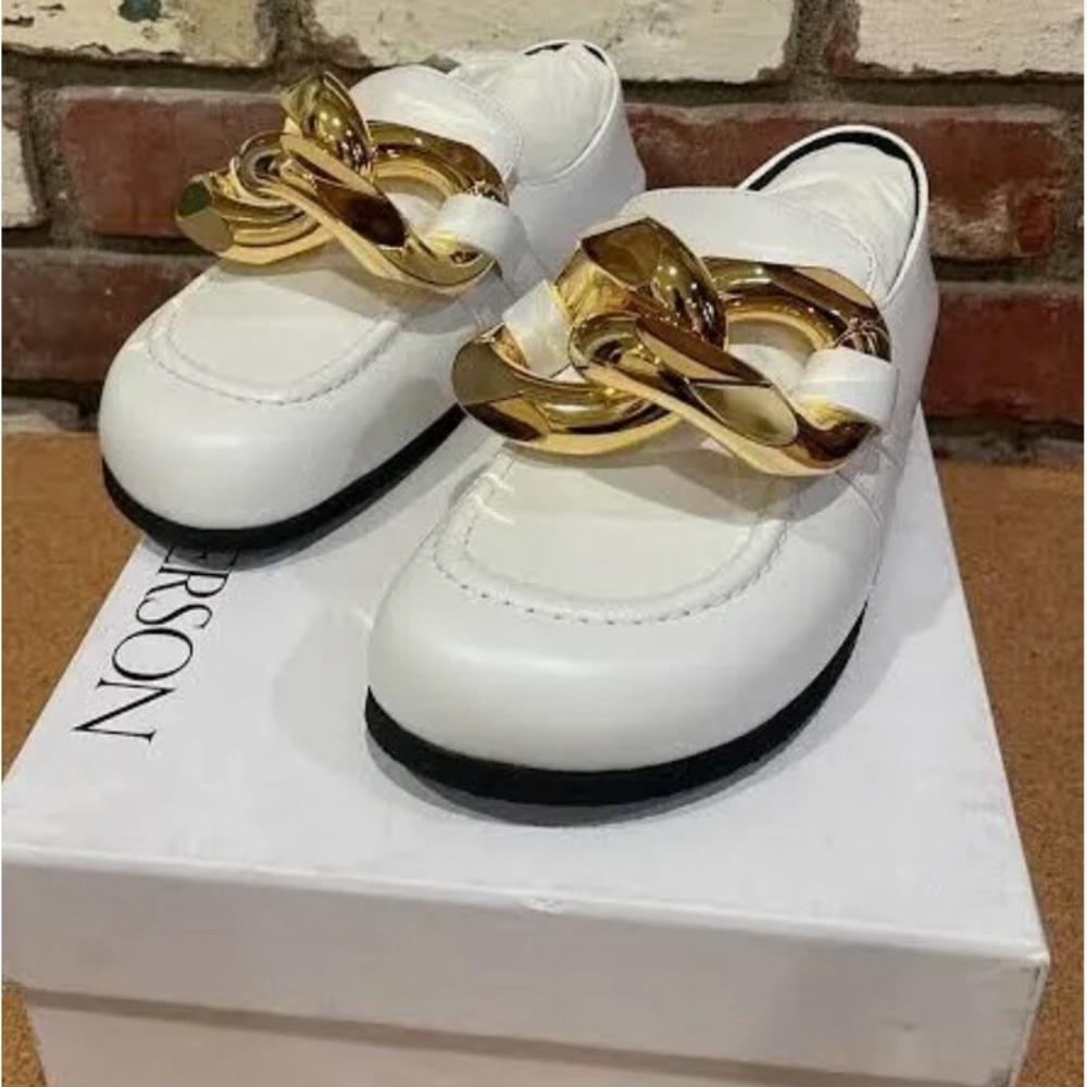 JW Anderson, white with the gold fitting, amazing pair.